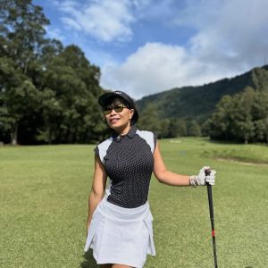 Ladies top black with small star motif short sleeve w white shoulder saddle on front and back panels-rear zip peter pan collar