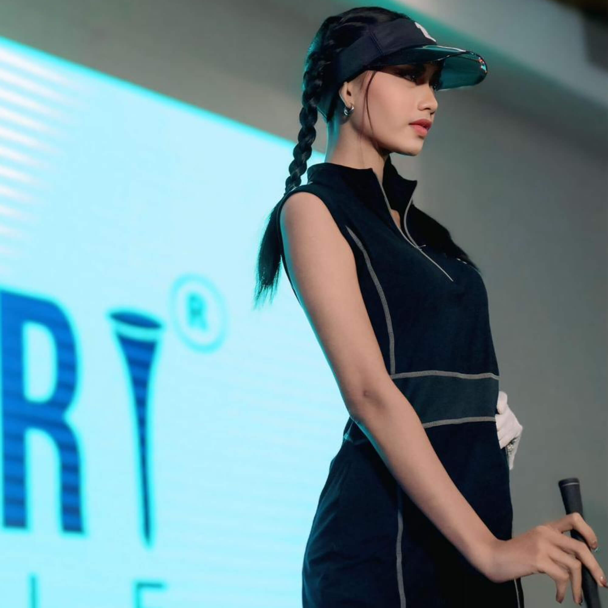 TG-GD-035 | Ladies sleeveless golf dress black with zipper mock polo neck and white overlock stitching - Image 3