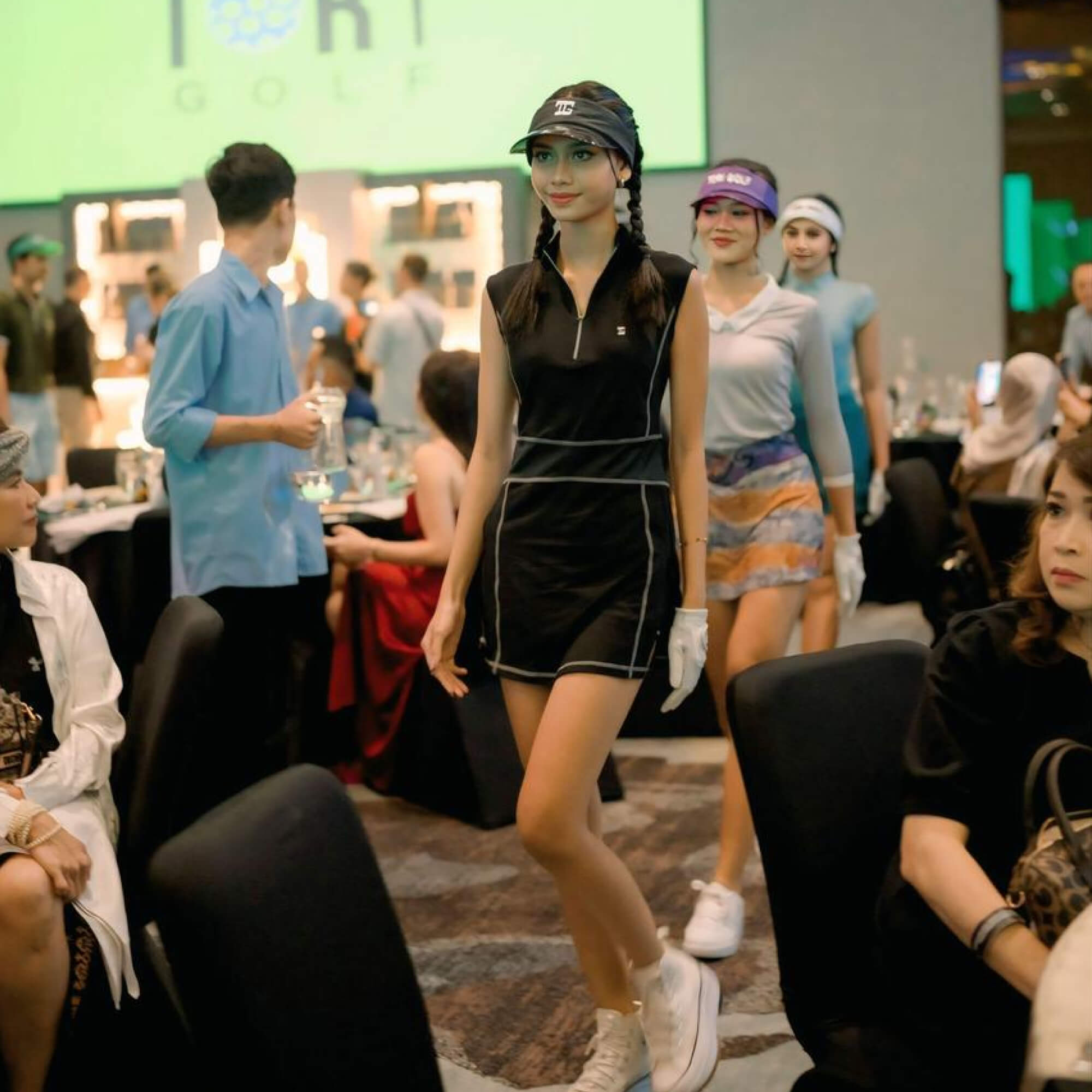 TG-GD-035 | Ladies sleeveless golf dress black with zipper mock polo neck and white overlock stitching - Image 2