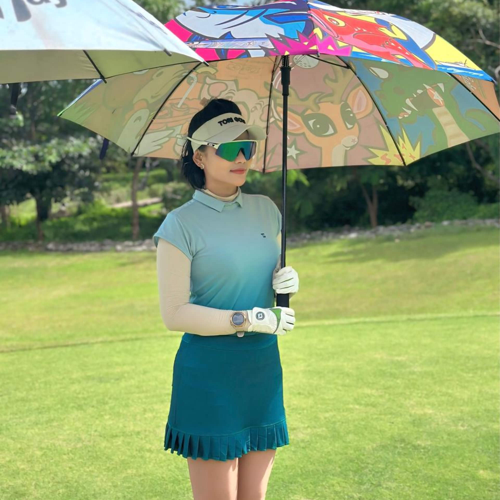 TG-LGS-022 | Ladies short sleeve golf set motion blue with green tosca gradation and pleated skirt with side pockets - Image 2